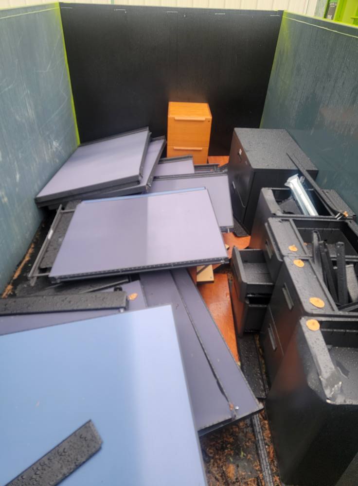 Construction debris from Auburn remodel being unloaded at recycling facility