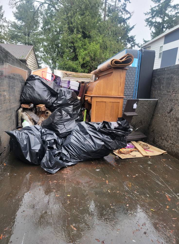Before and after renovation cleanup showing debris removal by Skookum Hauling in Auburn, WA